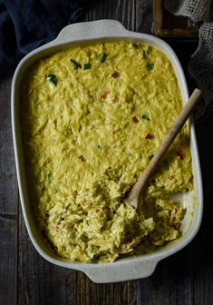 a casserole dish filled with yellow colored food