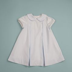 Our little girl's pleated dress is perfect for church or any special occasion. This fully lined dress has inverted front and back pleats and stylish short cap sleeves, also with pleats. It closes at center back with buttons. Both dress and lining are 100% cotton. Classic A-line Dress With Accordion Pleats, Fitted Short Sleeve Puff Sleeve Dress, Classic Short Sleeve Dress For Baptism, Classic A-line Pleated Dress With Accordion Pleats, Classic A-line Pleated Dress, Classic Fitted Dress For Baptism, Classic Fitted Dress With Pleated Bodice, Classic Fitted Pleated Dress, Classic Fitted Dress With Accordion Pleats