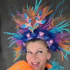 Beautiful Phoenix Fire Mardi Gras headdress could be a great addition to your fun party outfit... Decorated with sparkly blue, orange twigs, sparkly blue balls, pink hearts, colorful mesh, tulle, sequin, ..in the middle two Azure blue, Pink, Gold embroidered Phoenix birds. Blue back side.  Light weight, elastic in the back, fits most heads. Colors might look sliightly different from pictures due to your screen setting. All crowns hand made. Shipped by USPS next business day! NO refunds, NO returns, but please let me know if something wrong with your item.  Check my shop for other Holiday crowns and matching face mask. Contact me for special orders. Thank you for your interest in my design. Have fun, stay safe.