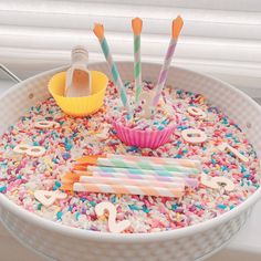 there is a cake with sprinkles and candles in it