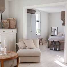 a living room filled with furniture and decor