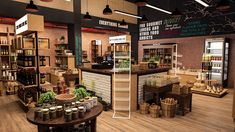 the inside of a store filled with lots of shelves and baskets full of food items