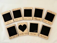 wooden photo frames with hearts and words on them