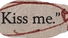 the words kiss me written on a stone