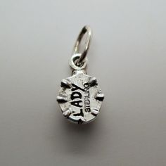 "This three-dimensional, sterling silver Ladybug charm is available in all silver or hand-enameled in a rich ruby red, with raised black spots, and a silver head. The word Lady and Sterling is inscribed on the bottom. Made by Brown County Silver. Vintage but in brand new, never worn condition. Hand-enameled: 3/4\" long and 3.0 grams All Silver: 3/4\" long and 2.8 grams" Nickel-free Round Pendant Charms, Silver Sterling Silver Charms For Birthday, Adjustable Engraved Silver Charms, Birthday Sterling Silver Charms In Silver, Engraved Silver Charms, Collectible Nickel-free Sterling Silver Charms, Adjustable Engraved Sterling Silver Charms, Silver Enamel Charms With Lobster Clasp, Silver Enamel Charms For Gift