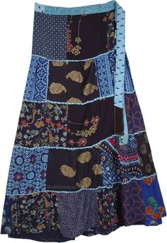 A blue-toned horizontal patchwork rayon skirt in wrap-around style. The patchworks are joined together and highlighted on the seams by a thick bundled thread (dori) to give a fascinating look. #tlb #WrapAroundSkirt #Patchwork #Floral #Printed #bohemianfashion #Handmade #Doripatchworkskirt #HippiePatchworkSkirt #RecycledPatchworkSkirt Saree Upcycle, Blue Long Patchwork Skirt, Blue Patchwork Long Skirt, Summer Patchwork Wrap Skirt, Flowy Cotton Patchwork Skirt, Multicolor Patchwork Flowy Skirt, Blue Cotton Patchwork Skirt, Hippie Multicolor Patchwork Maxi Skirt, Hippie Cowgirl