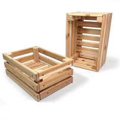 two wooden crates sitting next to each other on a white surface with no one in it