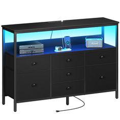 PRICES MAY VARY. Always by Your Side. Black Dresser Overall Dimensions: 43.7"L x 11.8"W x 30.6"H 【LED Dresser TV Stand】 The TV stand for bedroom boasts an LED strip controlled via an app or remote. Select from 22 dynamic modes and multi-color lights to match your mood or sync to music for an immersive gaming or movie night. Plus, you can use the timer for easy light control. This versatile bedroom furniture personalizes your space and adds a unique style to any room 【TV Dresser with Charging Sta Tv Stand Dresser, Cool Gaming Rooms Tv Stands, 50 Inch Tv Stand, 88 Inch Black Tv Stand, Tv Stand Black And Grey, Black 55 Inch Tv Stand, Kids Tv Stand, Walmart Tv Stand Black, Bedroom Tv Stand