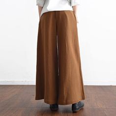 Spring Casual Linen Women Pants Elastic Waist Loose Fashion Wide Leg Pants Chic Brown Cotton Bottoms, Chic Brown Cotton Wide Leg Pants, Chic Brown Cotton Pants, Brown High Waist Relaxed Fit Bottoms, Versatile Wide Leg Brown Pants, Brown Wide Leg Bottoms With Relaxed Fit, Baggy Brown Bottoms With Elastic Waistband, Versatile Baggy Wide-leg Pants, Baggy Wide-leg Pants With Versatile Style