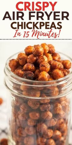 a jar filled with crispy air fryer chickpeas on top of a table