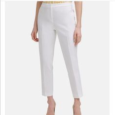 From Tommy Hilfiger, These Pants Feature: Compression Cotton Fabrication Flat Front, Straight Leg Silhouette Elastic At Back Waist Two Slant Front Pockets Two Besom Back Pockets Logo Bar At Wearer's Front Left Pocket Zip Fly With Hook And Hidden Bar Closure Lined Size & Fit Approx. Inseam: 28"; Ankle Length Mid Rise: Approx. 10"; Sits Just Below Natural Waist; Slim Leg Shell 54% Linen, 46% Rayon, Lining- 95% Polyester And 5% Spandex. Dry Clean Note: The Color Is Ivy- Which Is Like Beige. Spring Slim Fit Elastane Dress Pants, Ankle-length Elastane Dress Pants For Summer, Summer Ankle-length Elastane Dress Pants, Formal Cropped Leg Dress Pants For Spring, Spring Tommy Hilfiger Pants With Pockets, Formal Cropped Leg Spring Pants, Formal Cropped Leg Pants For Spring, Formal Cropped Pants For Spring, Tommy Hilfiger Straight Leg Spring Pants