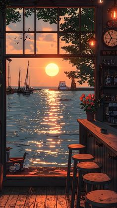 an open window overlooking the ocean with boats in the water and sunset seen through it