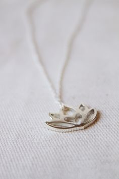 An original Lola&Cash protea necklace featuring a hidden heart -- d e t a i l s -- -protea measures 2cm wide -hand sawn out of solid sterling silver -completed in a mirror finish -includes a 45cm chain This pendant is also available in gold as seen in last picture https://www.etsy.com/listing/621948340/gold-protea-pendant-solid-9ct-yellow?ref=shop_home_active_1 -All Lola&Cash jewellery will arrive gift wrapped ---------------------------------------- Please Note - Made to order - Rush or Silver Birth Flower Necklace For Wedding, Silver Birth Flower Charm Necklaces For Weddings, Silver Charm Necklaces With Birth Flower For Wedding, Silver Birth Flower Charm Necklace For Wedding, Silver Wedding Charm Necklaces With Birth Flower, Silver Wedding Charm Necklace With Birth Flower, Delicate Small Jewelry Gift, Sterling Silver Necklace With Flower Charm As Gift, Delicate Jewelry For Gifts