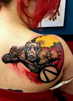 a woman with a tattoo on her shoulder that has an image of a man wearing a gas mask