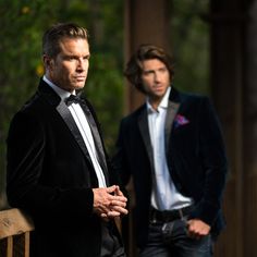 two men in tuxedos standing next to each other