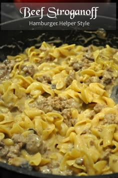 a skillet filled with pasta and meat