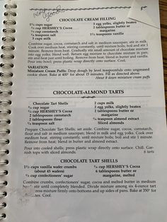 a recipe book with chocolate almond tarts on it and instructions for making the dessert