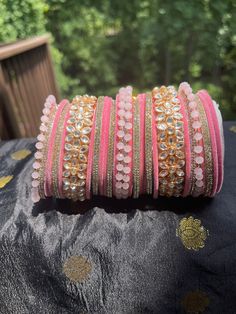 Party Bangle With Gota Work, Adjustable Kundan Bangle, Elegant Zari Work Bangle For Festive Occasions, Elegant Festive Bangle With Zari Work, Heavy Bangle For Festive Party, Adjustable Gold Bangle With Gota Work, Traditional Pink Meenakari Bracelets, Bollywood Style Cutdana Bracelets For Party, Kundan Bangle For Party