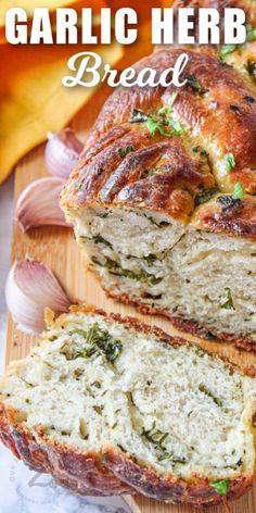 garlic herb bread is cut in half on a cutting board