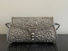 "For your consideration is a fabulous sterling silver .925 clutch handbag. It has a length of 5 5/8\", it is 3\" high and weights 318 grams. The purse is marked .925, and it is in great pre-owned condition. IMPORTANT DISCLAIMERS  We always take plenty of photos and provide detailed descriptions of our items. Therefore, you are asked to please check ALL posted photos and review the Description Section before purchasing an item from our store. Before listing, we clean and inspect our items for neatness and accuracy. However, if a problem with the purchased item arises, we have a very customer friendly return policy. TAXES: In order to comply with recent applicable tax law for marketplace facilitators, Etsy will calculate, collect, and remit sales tax on behalf of sellers for items shipped to Silver Purse, Kawaii Bag, Star Bowl, Silver Clutch, Snuff Bottle, Sales Tax, Louis Vuitton Speedy Bag, Handbag Purse, Clutch Handbag