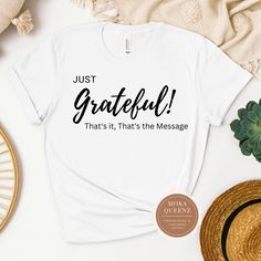 Express your gratitude in style with this comfortable and stylish Grateful Christian t-shirt! Made from soft, premium quality material, this t-shirt is perfect for everyday wear or casual outings. Show the world your appreciation with the simple yet powerful message printed on the front. Whether you're feeling thankful or want to spread positivity, this Grateful t-shirt is the perfect addition to your wardrobe. Available in a variety of sizes and colors, this shirt makes a great gift for yoursel Inspirational Crew Neck T-shirt For Fall, Inspirational Black Relaxed Fit T-shirt, Casual Custom Text T-shirt For Fall, Fall Casual T-shirt With Custom Text, Casual Fall T-shirt With Custom Text, Fall Slogan T-shirt For Everyday Wear, Fall Graphic Tee With Funny Text, Custom Text Crew Neck T-shirt For Fall, Inspirational Text Print T-shirt For Everyday