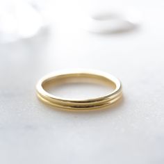 This is a sweet and simple ring that is perfect for a minimalist look, stacked with other rings, or as a simple wedding band. Made of 925 Sterling Silver Available in 14k Gold or Rhodium Plating We use a THICK 14k Gold plating - for a piece that will last you years to come! VERY HIGH QUALITY Available in sizes 4-12 Ring Height: 2.4mm Ring Sizer Layering Diamond Necklaces, Simple Wedding Bands, Double Band Rings, Minimal Ring, Pearl Collection, Gold Band Ring, Delicate Earrings, Rings Simple, Ring Size Guide