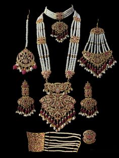 Ready to ship bridal set includes choker , earrings , jhoomar , tika , ring , bracelet and Rani haar made using cz stones , shell pearls , beads and gold plating Hand Set Ruby Bridal Sets For Wedding, Hand-set Kundan Necklace For Marriage, Hand Set Kundan Necklace For Marriage, Bollywood Style Pearl Sets With Stone Work, Pearl Jewelry With Stone Work For Wedding, Wedding Pearl Jewelry With Stone Work, Kundan Pearl Drop Jewelry For Wedding, Pearl Chandbali Wedding Jewelry, Pearl Chandbali Jewelry For Wedding