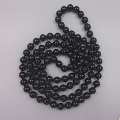 "Enjoy free shipping with this fabulous most popular beaded preknotted endless Black Onyx statement necklace. -36\" length -8MM Black Onyx beads -Hand knotted thread between each bead https://www.etsy.com/shop/MYGEMSROCK" Black Beaded Long Necklace With Round Beads, Black Beaded Necklace With Round Beads, Black Long Necklace With Round Beads, Black Necklaces With Hand-strung Round Beads, Hand-strung Black Necklace With Round Beads, Hand-strung Black Necklaces With Round Beads, Long Necklace With Round Black Beads As Gift, Long Necklace With Black Round Beads For Gift, Long Necklace With Black Beads As Gift