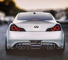 the rear end of a white sports car