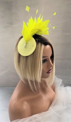 "Presenting a beautiful bright yellow/lemon feather fascinator with hand cut feathers on a straw percher/saucer base with silver beads and attached to your hair with a clearly plastic comb (please get in touch if you would like a headband adding), handmade in the UK using traditional millinery techniques to create a stunning formal piece to give that real wow factor to your outfit.   Staw base measures approximately 9.5cms in diameter. f you would like the design customising at all, or an altern Mardi Gras Headpiece, Feather Crown, Yellow Feathers, Ascot Hats, Feather Fascinator, Wire Headband, Duchess Satin, Feather Fascinators, Brown Satin