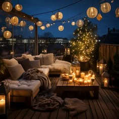 a living room with lots of lights on the ceiling and couches covered in blankets