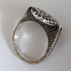 The ring is textured and oxidized, and have a modern, minimal contemporary design but a classic theme. ► MEASUREMENTS: I gave the ring a dark patina and then polished to a matte finish, except the top which is polished less to stand out. Ammonite size approx. 15 x 12 mm Ring total height: 2.4 cm The ring in the photos is ready to ship in 7.5 US size, but I can make this ring in any size you need. If the ring will be made to order, please allow 7 days after your payment. ►Please be sure of your r