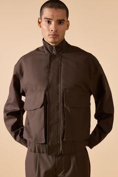 Keep out the chill while looking slick in a boohooMAN coat. Rev up your outerwear inventory this season with our unrivalled collection of coats and jackets for men. Whether you're looking for a heavy coat to combat the low temperatures, or a lightweight jacket to stand out while having fun at your favourite festival, we've got the trendiest designs to finish off your outfit with. Puffers, parkas and borg jackets are the perfect choices if you want to bundle up without sacrificing on style, and Cotton Techwear Outerwear With Stand Collar, Utility Outerwear With Ribbed Cuffs For Outdoor, Utility Outdoor Outerwear With Ribbed Cuffs, Trendy Brown Outerwear With Ribbed Cuffs, Cotton Techwear Utility Jacket For Fall, Fall Techwear Cotton Utility Jacket, Winter Solid Outerwear With Flap Pockets, Fall Cotton Techwear Utility Jacket, Fall Techwear Windbreaker For Cold Weather