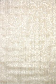 a white rug with an intricate design on it