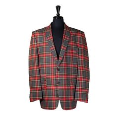 This Chiragh Apparel Blazer Is An Elegant Upgrade On Dapper Tailoring And Features Rich Shades In A Sumptuous Fabric For Elegant Opulence. Fashioned From Premium Quality Wool, This Tartan Plaid Blazer Features Full Lining In Japanese Silk, A Notch Lapel, Two-Button Closure And Single-Vented Back. A Left Chest Pocket And Three Flap Pockets Appoint The Front While The Inside Has Two (2) Pockets On The Left And One (1) Pocket On The Right. A Flash Of Colored Piping Is Added To The Jacket Lining Ins Red Festive Semi-formal Blazer, Classic Tailored Festive Blazer, Festive Long Sleeve Business Blazer, Notch Lapel Blazer For Business And Festive Occasions, Red Festive Formal Blazer, Festive Red Formal Blazer, Red Fitted Nehru Jacket For Fall, Festive Long Sleeve Tailored Blazer, Festive Red Semi-formal Blazer