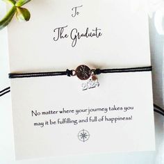 a bracelet that says, to the graduate no matter where your journey takes you may be fulling and full of happiness