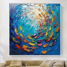 an abstract painting on the wall of a living room