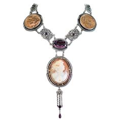 Jill Garber Antique Goddess Cameo, Amethyst with French Medals Drop Necklace | From a unique collection of vintage Drop Necklaces at https://www.1stdibs.com/jewelry/necklaces/drop-necklaces/. Luxury Vintage Amethyst Jewelry, 1stdibs Jewelry, Purple Choker, Filigree Frame, Bronze Goddess, Drop Necklaces, Amethyst Set, Diamond Bows, Cameo Brooch