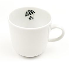 a coffee cup with an umbrella painted on the outside and inside, sitting in front of a white background