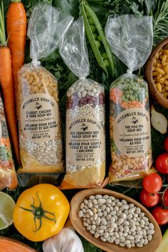 several different types of food are laid out on the table with their names in bags