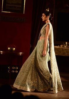 A pale blue tulle & floral sari by Sabyasachi for India Couture Week 2014. Shop for your dream wedding trousseau, with a personal shopper & stylist in India - Bridelan, visit our website www.bridelan.com #Bridelan #Sabyasachi Sabyasachi Dresses, Saree Ideas, Personal Fashion Stylist, Grey Saree, Punjabi Fashion, Half Sarees