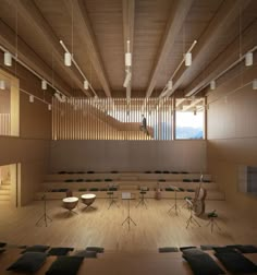 an empty lecture hall with tables and chairs