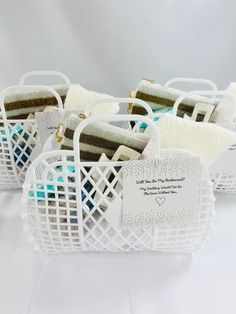 several white baskets filled with different types of items