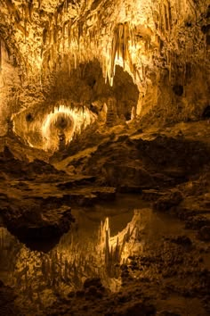 the inside of a cave with water in it