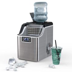 an ice cream maker with a green drink next to it