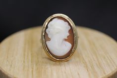 Precious Bezel set Shell cameo ring. Set in 10k yellow gold. Vintage made before middle of century. Marked BDA - Budlong, Dockert & Armstrong Condition: shows signs of wear consistent with old age. Details 3.7grams total weight 10k gold and carved shell 20mm by 15mm rectangle cameo Carved 14k Gold Jewelry, Elegant Carved 14k Gold Jewelry, Carved 14k Gold Jewelry For Wedding, Heirloom Carved Ring Jewelry, Vintage Carved Jewelry For Anniversary, Carved Vintage Jewelry For Anniversary, Classic Carved Yellow Gold Jewelry, Carved 14k Gold Jewelry For Formal Occasions, Carved 14k Gold Jewelry For Anniversary