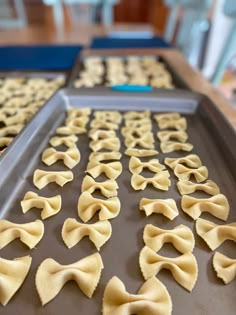 uncooked ravioli on a baking sheet ready to go into the freezer