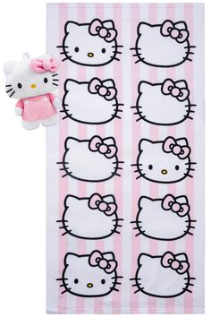 a hello kitty towel with pink and white stripes