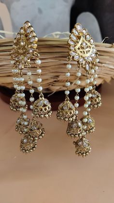 Antique Gold Long Kundan Polki Earrings Bahubali Inspired | Fashion Earrings | Wedding gift | Bridal Earring | Gold Plated long Earring We bring you casual as well as party wear jewelry which comes with an attractive design and helps in boosting your style factor. A classic fusion of exquisite craftsmanship and elegance, this jewelry tries to make you look graceful and stylish when paired with your attire. It goes well with modern and traditional outfits.  These Earrings are made of Alloy, Pure Copper and Kundan and Pearls . Trust me the quality of Earrings is the Best  Women love jewelry; specially traditional jewelry adore a women. They wear it on different occasion. They have special importance on ring ceremony, wedding and festive time. They can also wear it on regular basics. Make you Luxury Kundan Earrings For Engagement, Luxury Kundan Bridal Earrings For Celebration, Luxury Kundan Bridal Earrings For Wedding, Luxury Traditional Bridal Earrings With Gota Work, Luxury Traditional Bridal Earrings With Latkans, Luxury Bridal Earrings With Latkans For Parties, Luxury Chandbali Bridal Earrings With Matching Design, Luxury Chandbali Bridal Earrings For Festivals, Luxury Hand Set Chandbali Chandelier Earrings