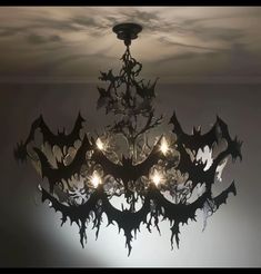 a bat chandelier hanging from the ceiling